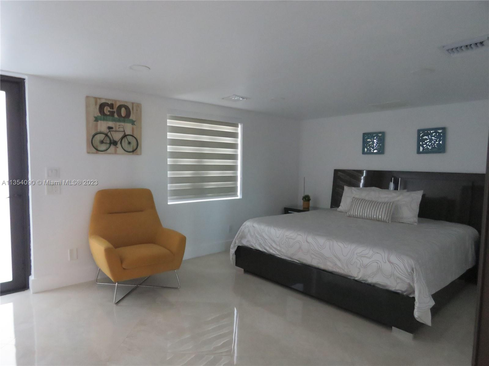 Redlands Homestead, FL 33031 - Photo 31 of 56 a bedroom with a bed and a couch