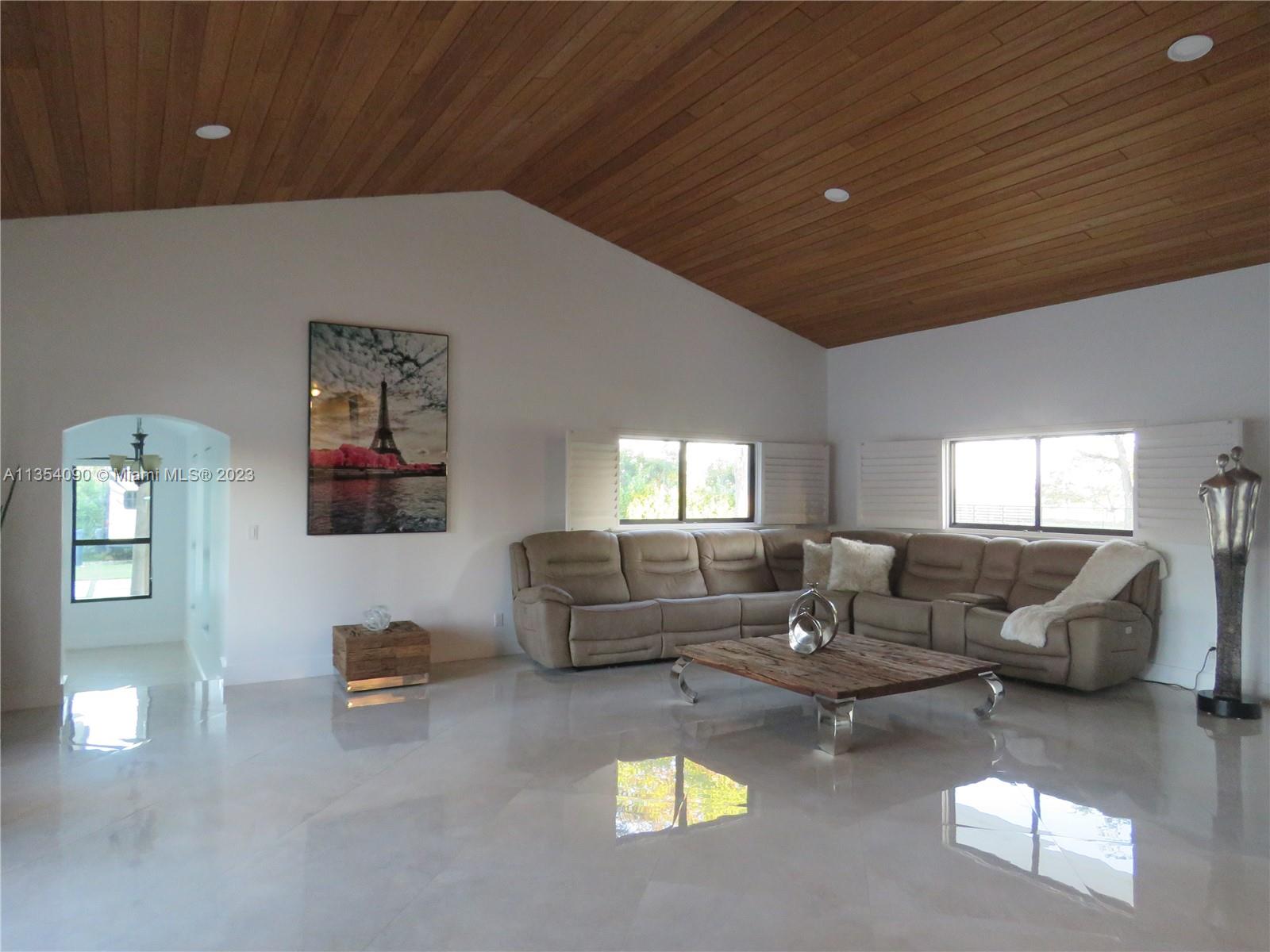 Redlands Homestead, FL 33031 - Photo 36 of 56 a living room with furniture and a large window