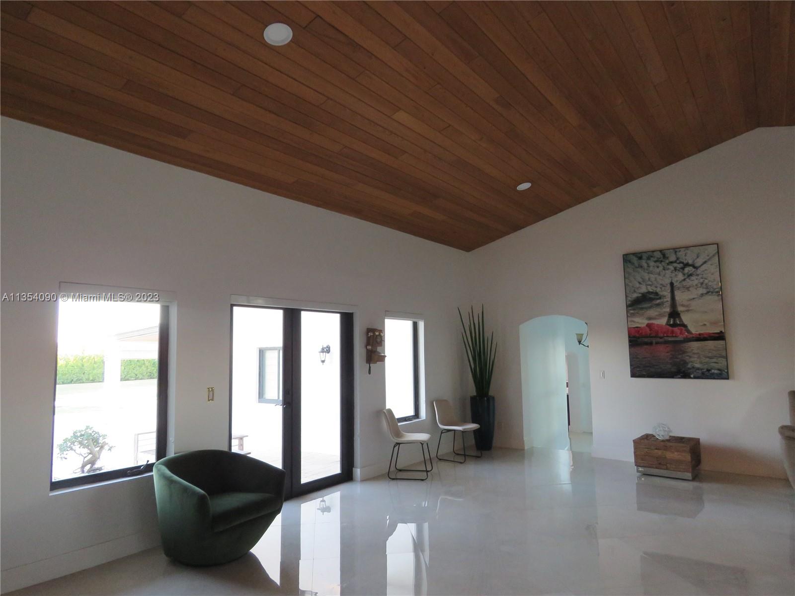 Redlands Homestead, FL 33031 - Photo 38 of 56 a living room with furniture and a large window