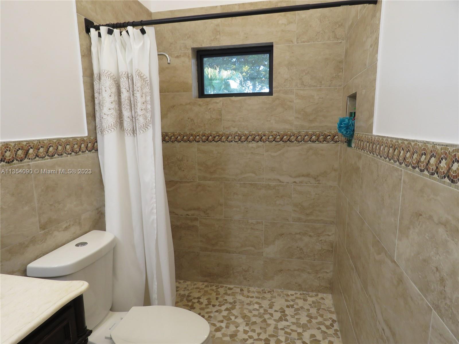 Redlands Homestead, FL 33031 - Photo 39 of 56 a bathroom with a toilet and a shower
