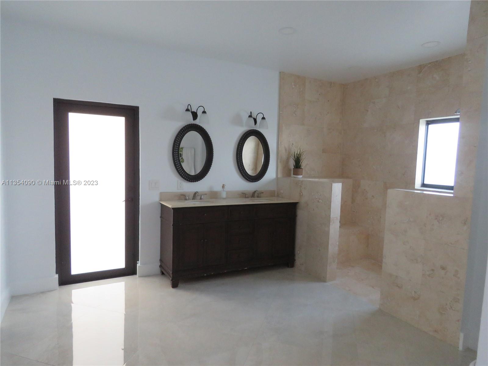 Redlands Homestead, FL 33031 - Photo 42 of 56 a bathroom with a sink and a mirror
