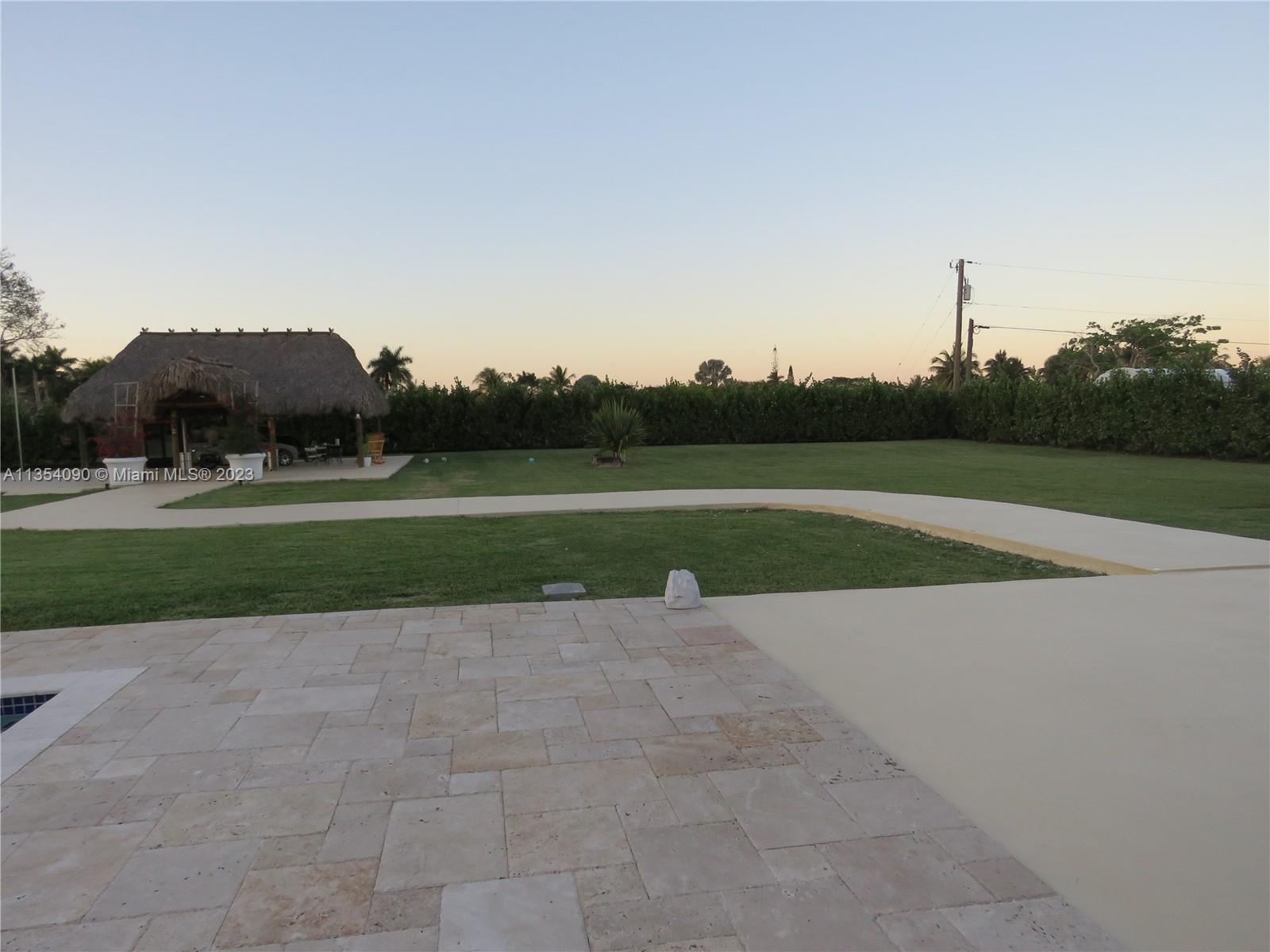Redlands Homestead, FL 33031 - Photo 49 of 56 a view of a golf course with a lake