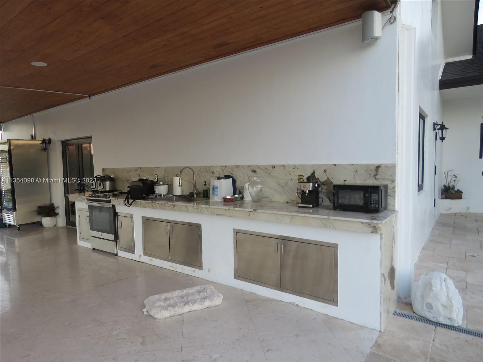 Redlands Homestead, FL 33031 - Photo 53 of 56 a kitchen with stainless steel appliances granite countertop a stove a sink and a refrigerator