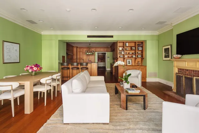 a living room with fireplace furniture and a flat screen tv