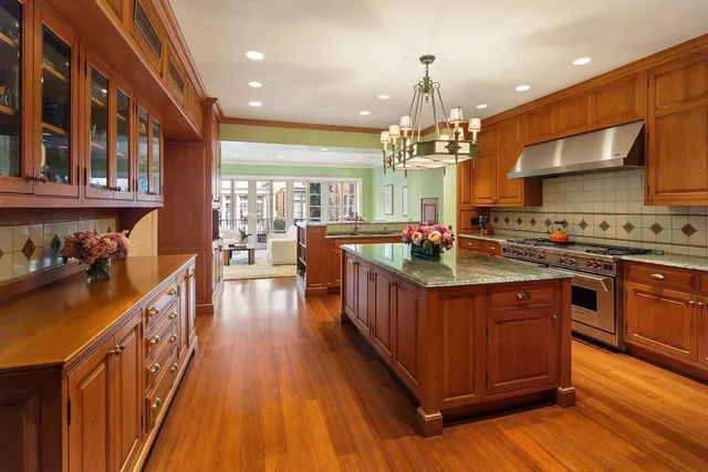 a living room with fireplace furniture and a flat screen tv