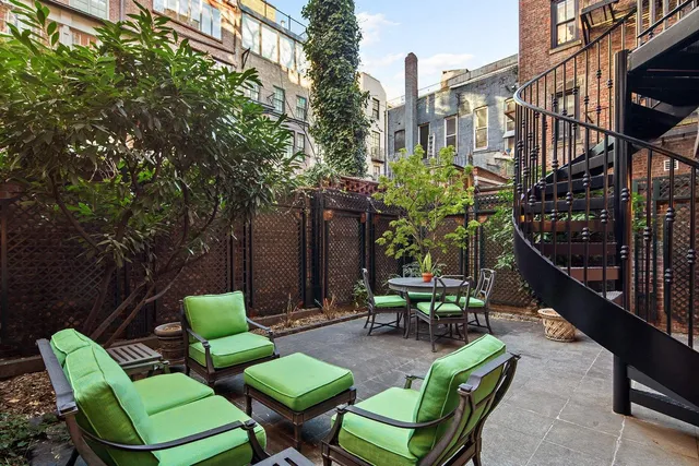 a kitchen with stainless steel appliances granite countertop a stove a sink dishwasher a refrigerator and a oven with wooden floor