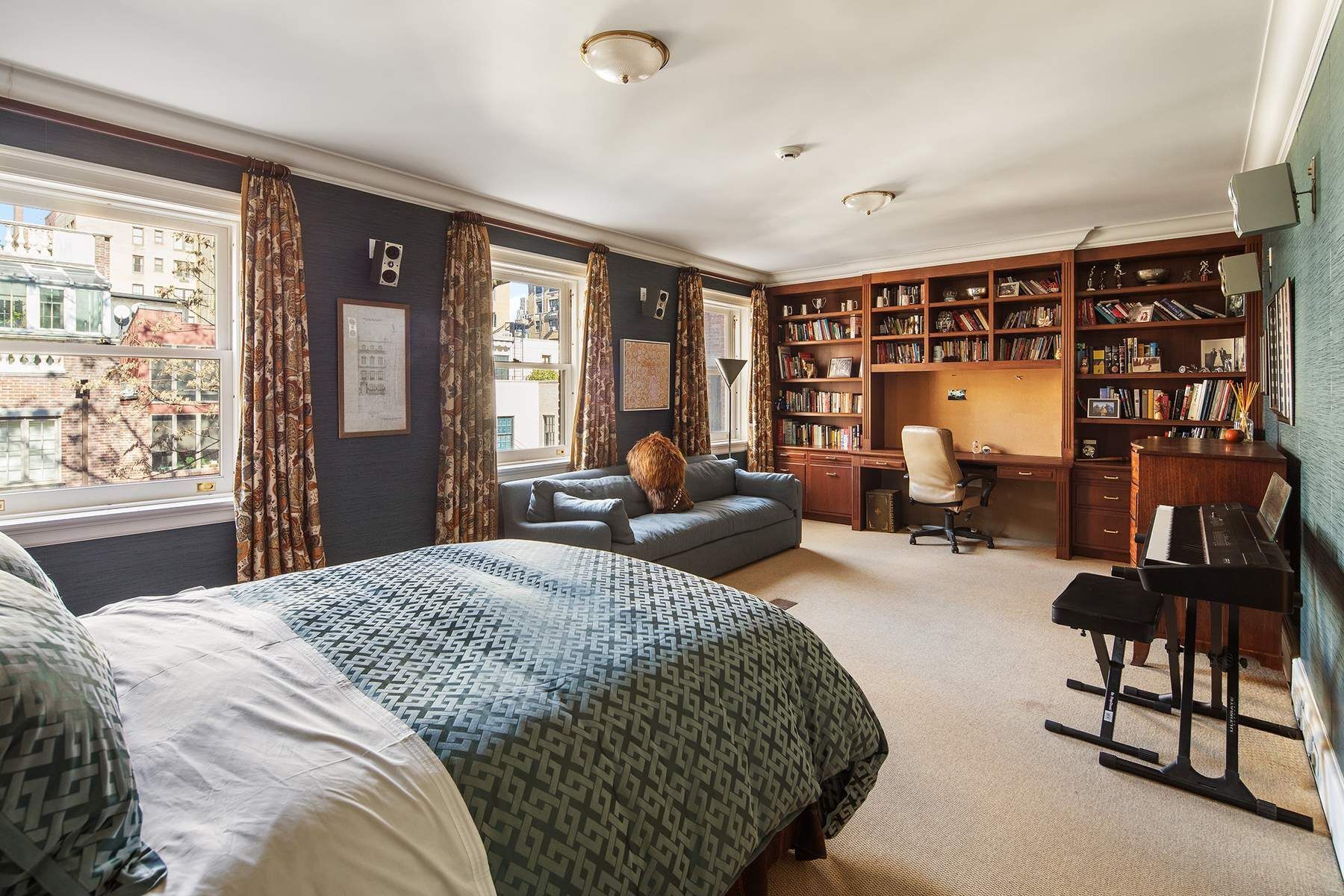 123 East 73rd Street Manhattan, NY 10021 - Photo 14 of 24 a bedroom with a large bed and a large window