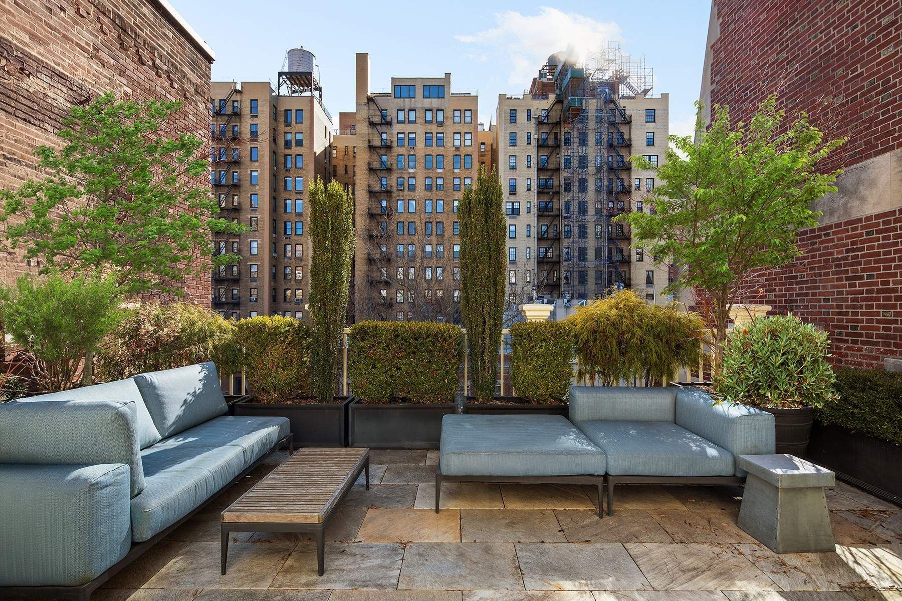 123 East 73rd Street Manhattan, NY 10021 - Photo 17 of 24 a view of a patio with couches and a potted plant