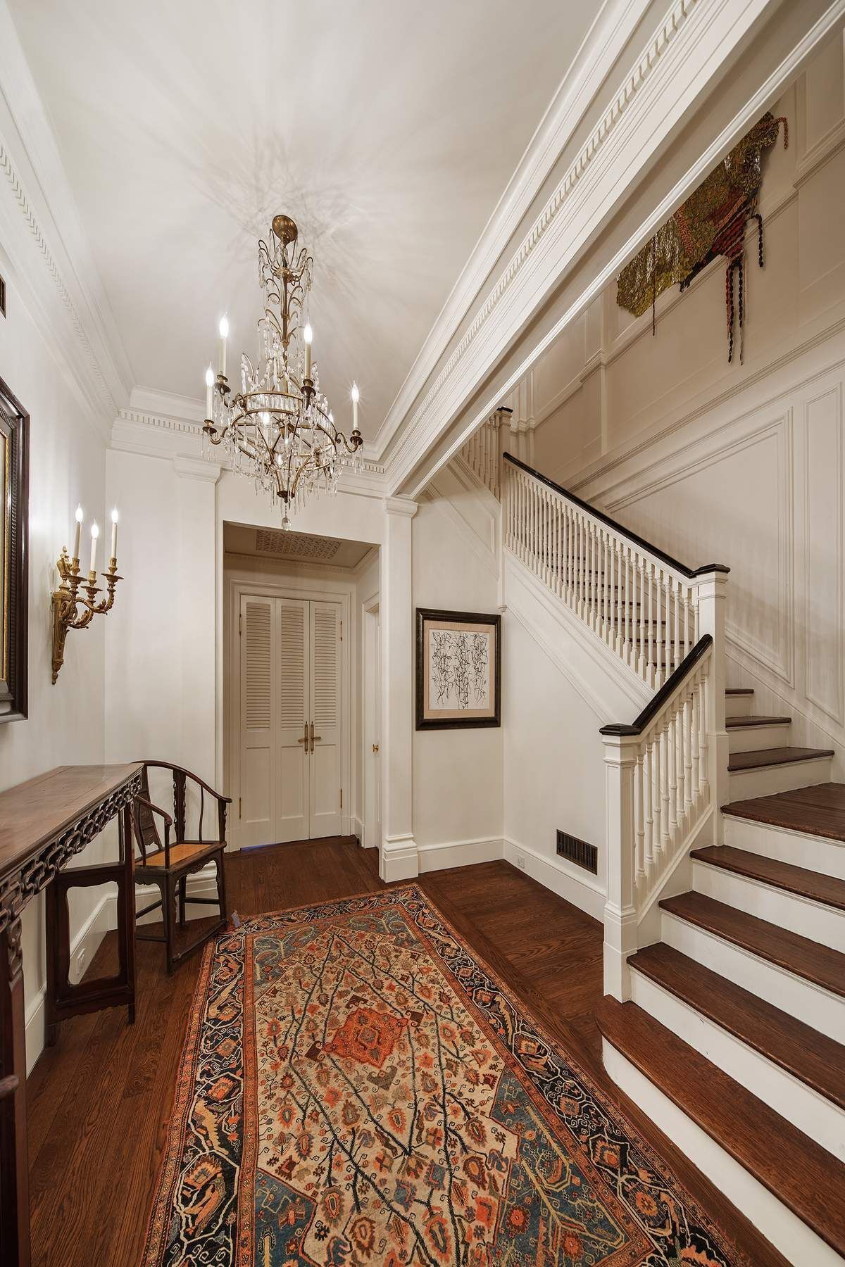 123 East 73rd Street Manhattan, NY 10021 - Photo 21 of 24 a view of a livingroom with wooden floor and stairs