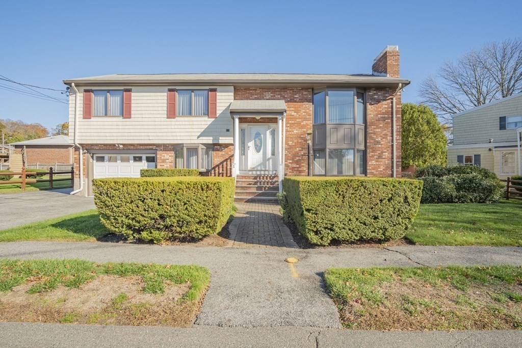 1 Christopher Drive Nahant, MA 01908 - Photo 1 of 41 front view of a house with a garden