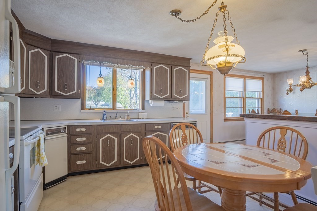 1 Christopher Drive Nahant, MA 01908 - Photo 15 of 41 a view of a dining area with furniture window and wooden floor