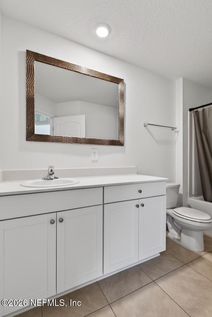 45 Seaport Breeze Road St. Augustine, FL 32095 - Photo 58 of 88 a bathroom with a sink a toilet and a mirror