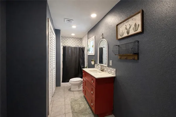 a bathroom with sink and mirror