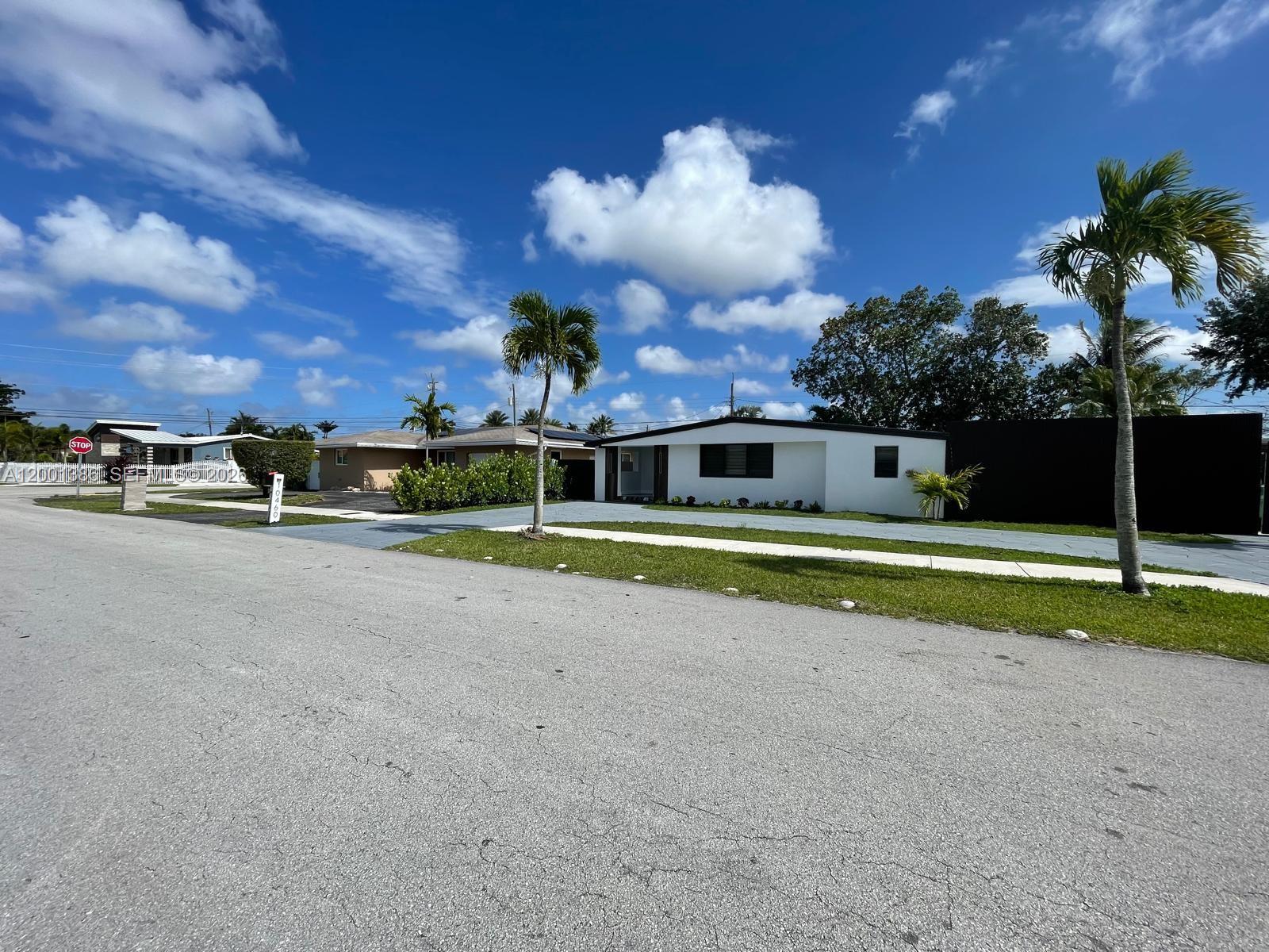 10460 Southwest 26th Terrace Miami, FL 33165 - Photo 1 of 28 a view of a house with a big yard