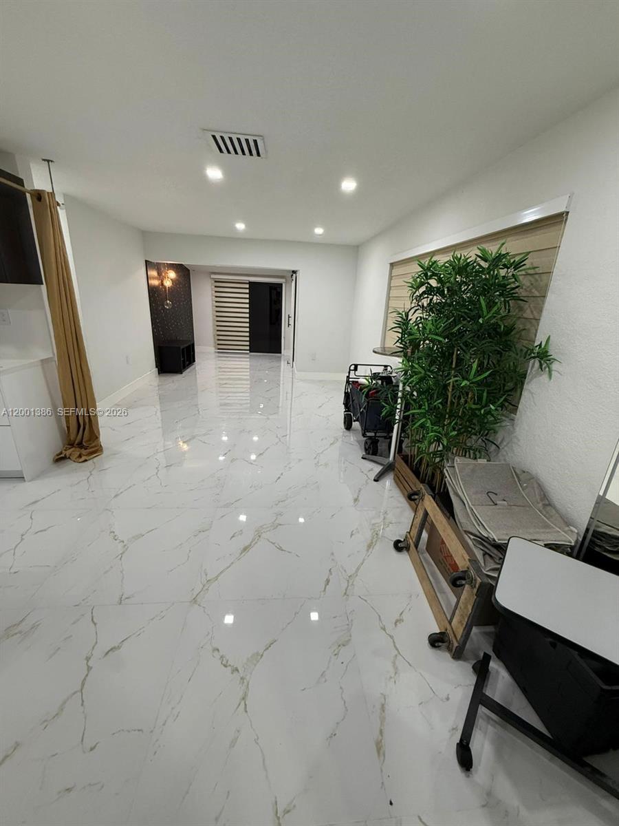 10460 Southwest 26th Terrace Miami, FL 33165 - Photo 11 of 28 a room with furniture and a window