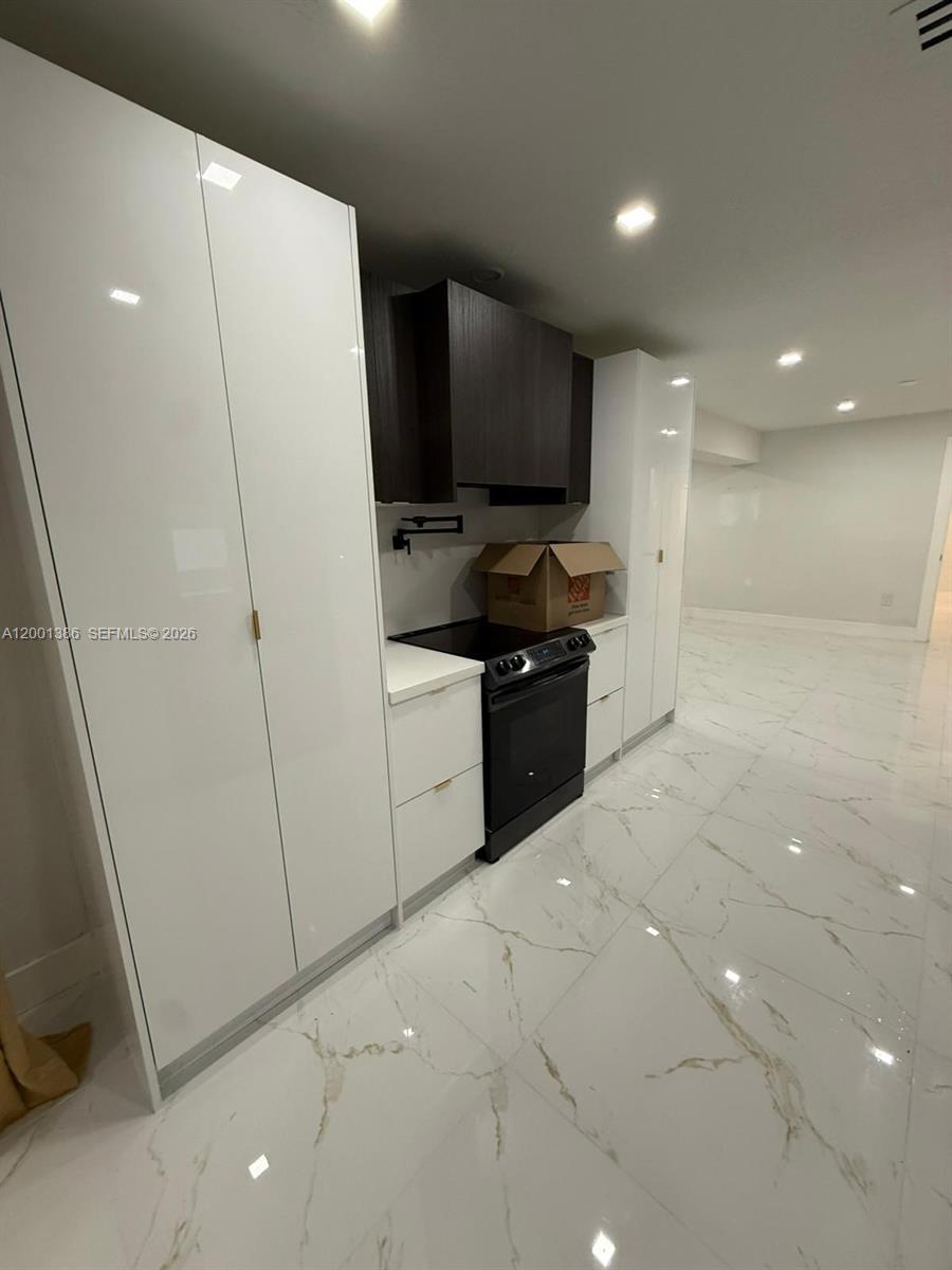 10460 Southwest 26th Terrace Miami, FL 33165 - Photo 12 of 28 a kitchen with stainless steel appliances a refrigerator and a sink