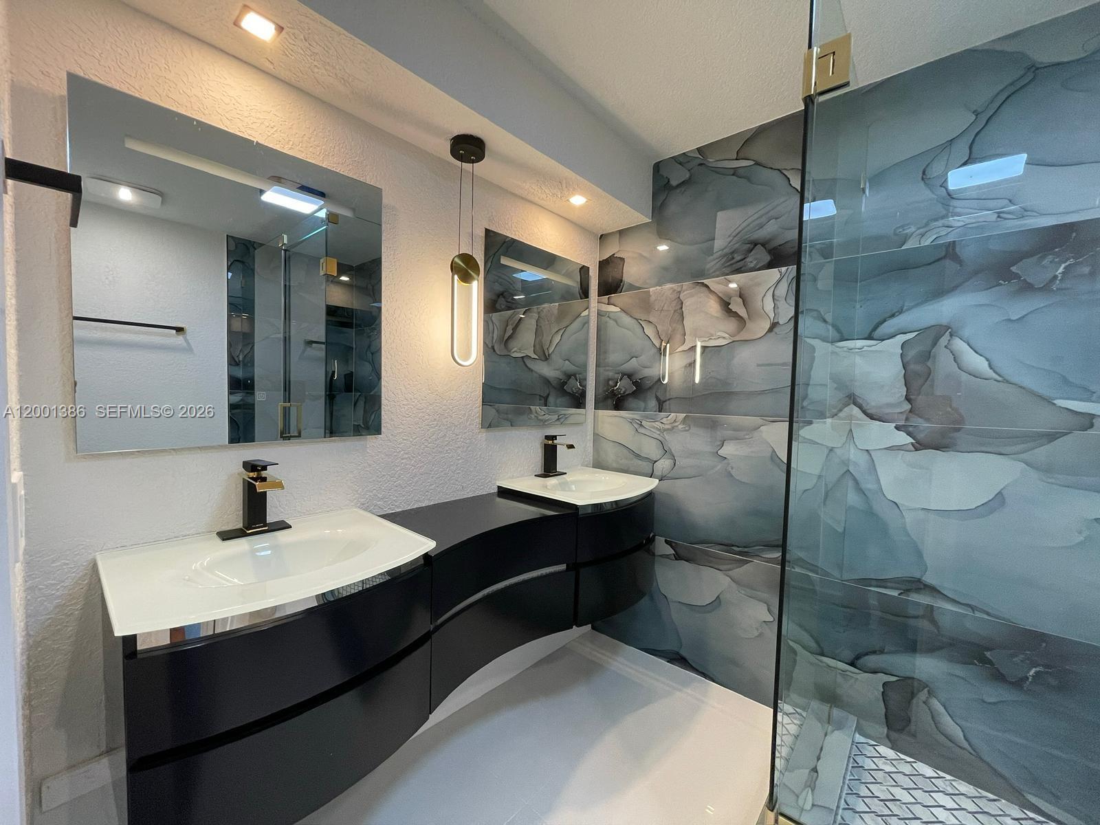 10460 Southwest 26th Terrace Miami, FL 33165 - Photo 7 of 28 a bathroom with a sink and mirror