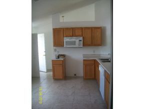 1320 Southeast Ran Palm Bay, FL 32909 - Photo 2 of 8 a kitchen with a sink and cabinets