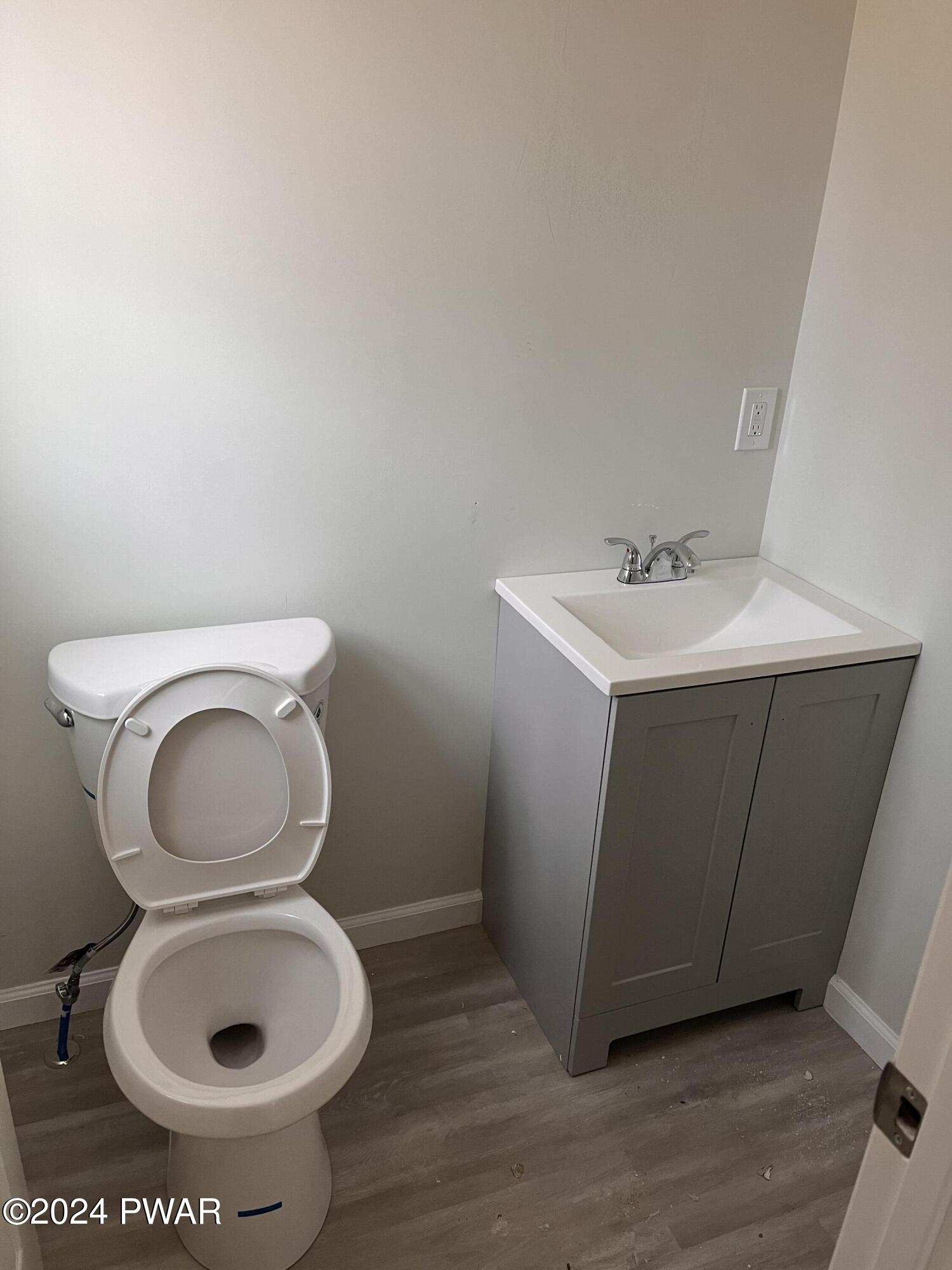 128 Stonehenge Road Milford, PA 18337 - Photo 6 of 14 a bathroom with a toilet and a sink