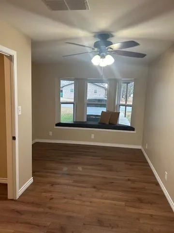 a view of an empty room and window