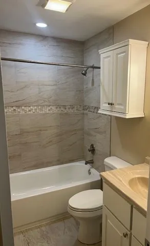 a bathroom with a sink a toilet and a bathtub