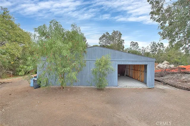 a view of a house with a yard and garage