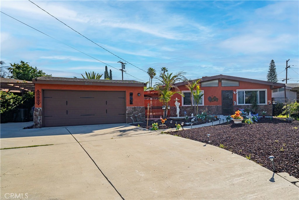 a front view of house with yard and outdoor seating