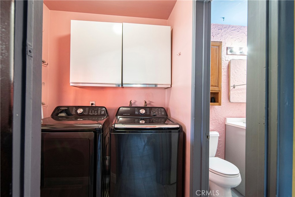 9417 Mango Avenue Fontana, CA 92335 - Photo 15 of 41 a kitchen with a stove sink and toilet