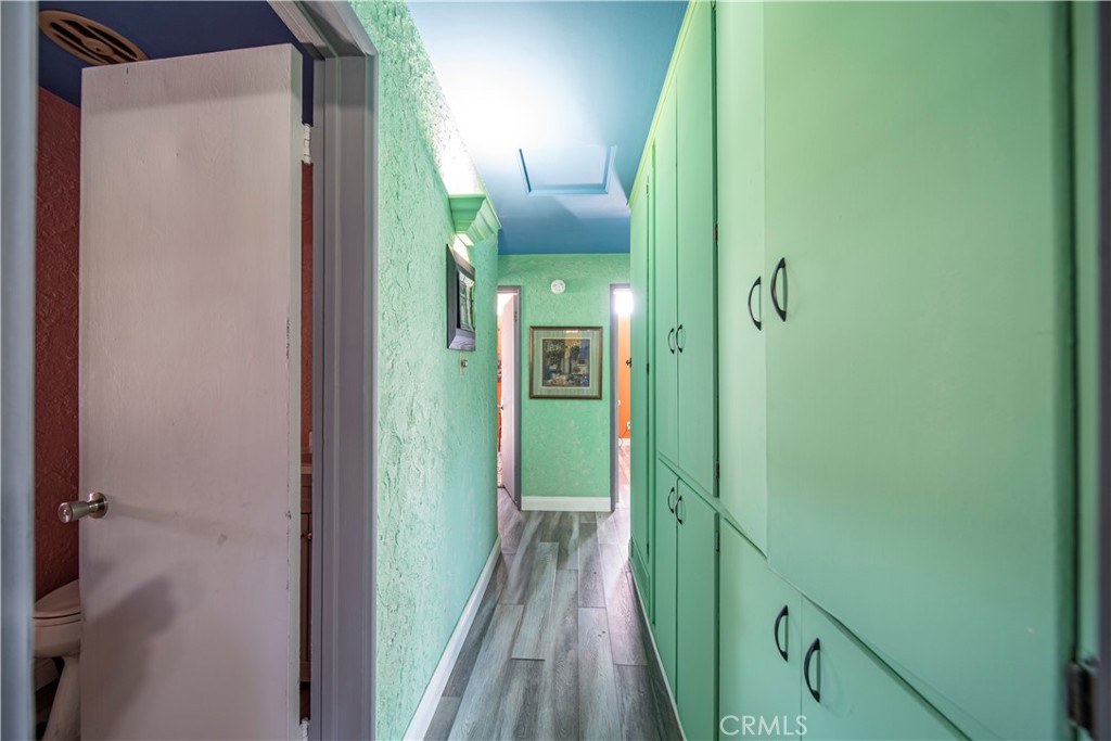 9417 Mango Avenue Fontana, CA 92335 - Photo 16 of 41 a bathroom with a sink and glass door