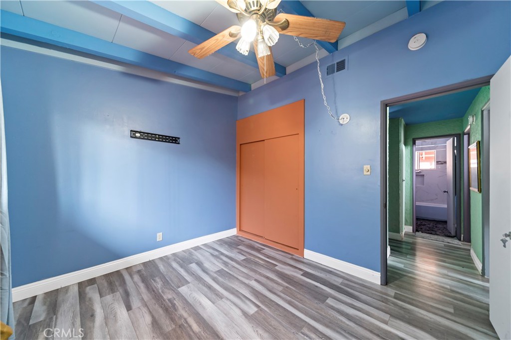 9417 Mango Avenue Fontana, CA 92335 - Photo 17 of 41 a view of an empty room with wooden floor