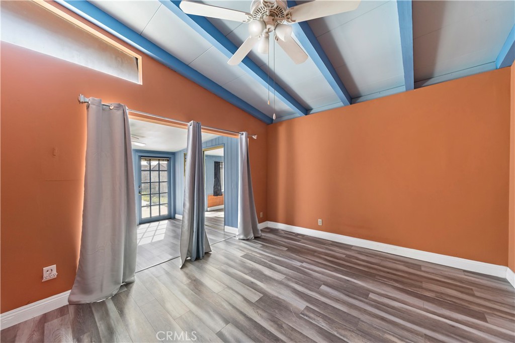 9417 Mango Avenue Fontana, CA 92335 - Photo 20 of 41 a view of a room with wooden floor