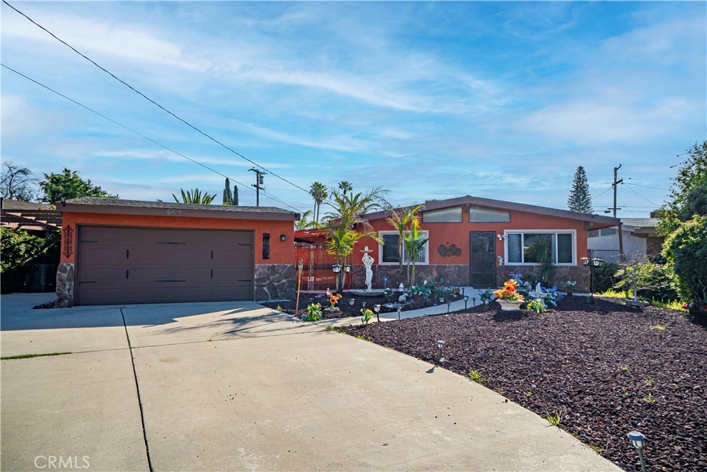9417 Mango Avenue Fontana, CA 92335 - Photo 2 of 41 a front view of house with yard