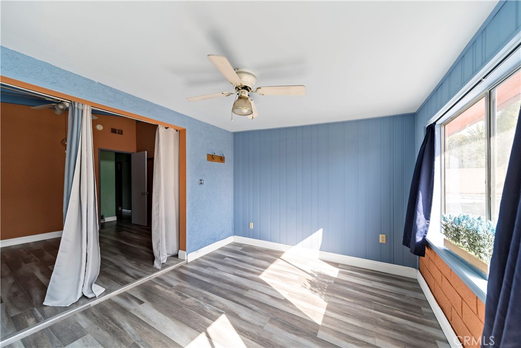 9417 Mango Avenue Fontana, CA 92335 - Photo 21 of 41 a bedroom with a bed and a window