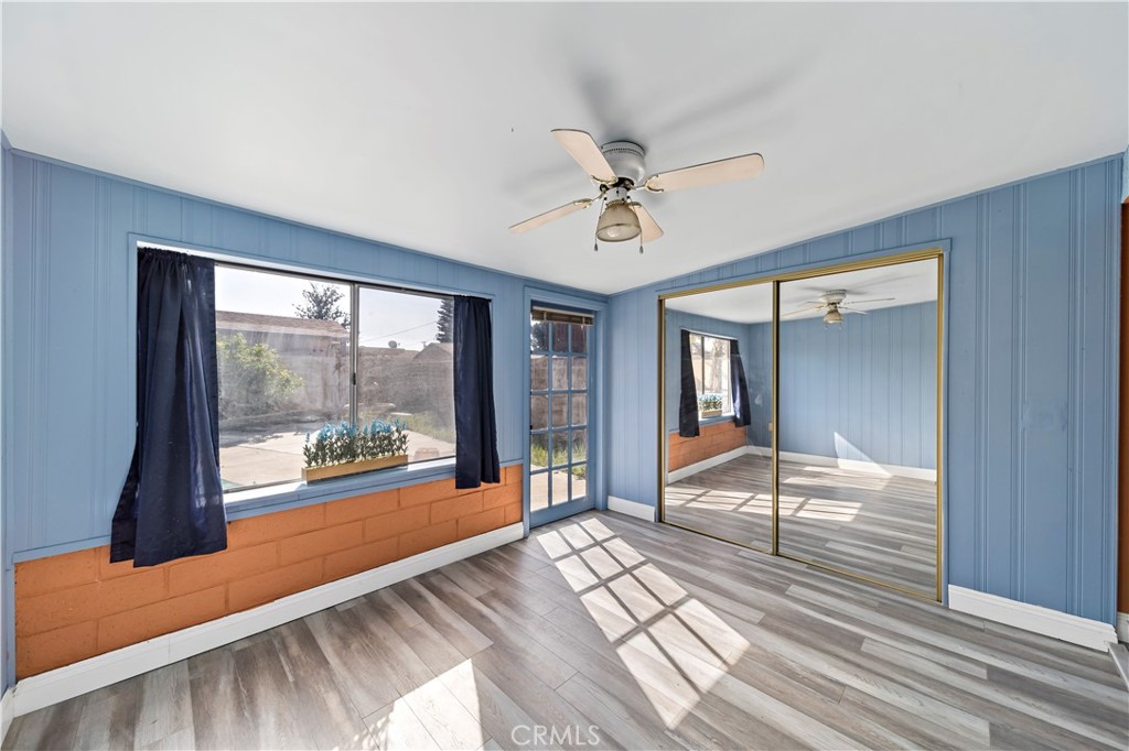 9417 Mango Avenue Fontana, CA 92335 - Photo 22 of 41 a view of a room with wooden floor and balcony