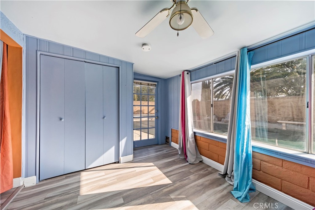 9417 Mango Avenue Fontana, CA 92335 - Photo 24 of 41 a view of a room with wooden floor and windows