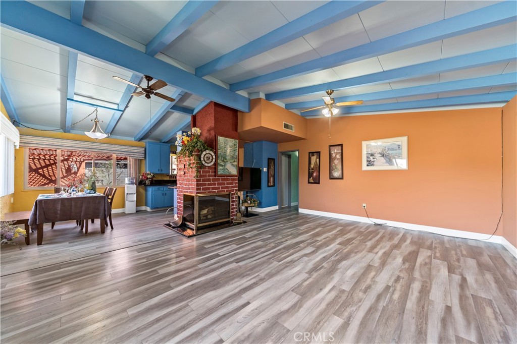 9417 Mango Avenue Fontana, CA 92335 - Photo 7 of 41 a view of a room with wooden floor