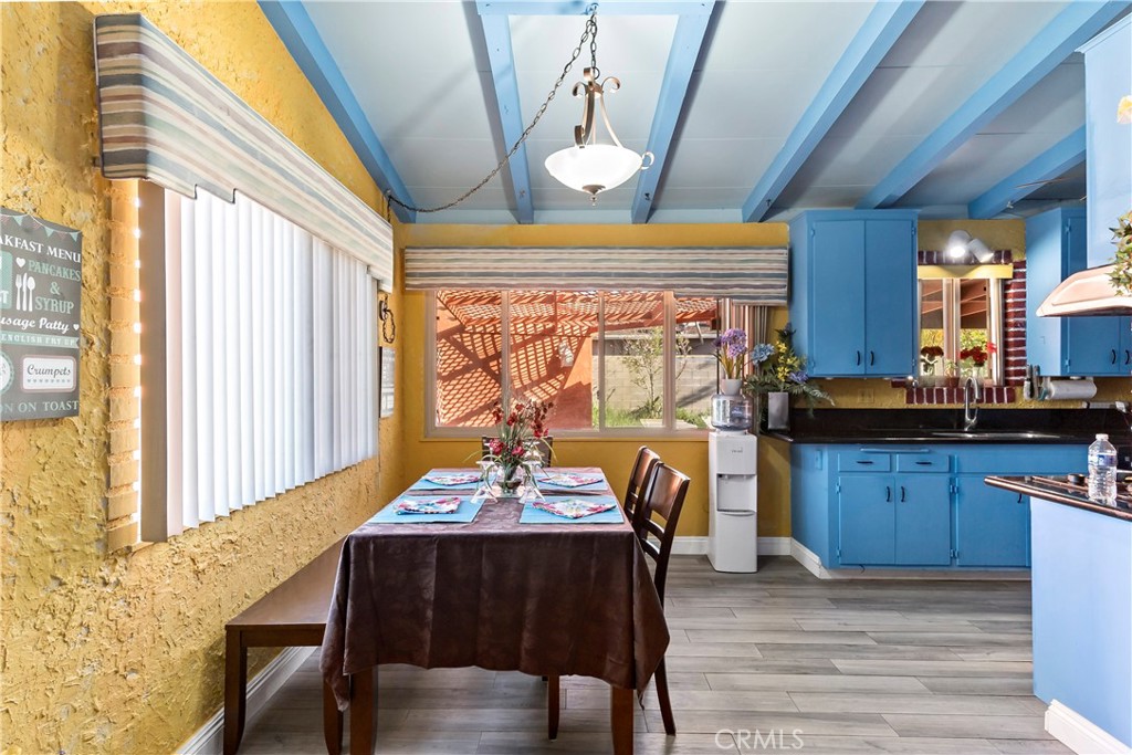 9417 Mango Avenue Fontana, CA 92335 - Photo 8 of 41 a view of a dining room with furniture window and wooden floor