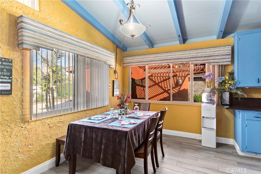 9417 Mango Avenue Fontana, CA 92335 - Photo 9 of 41 a dining room with wooden floor
