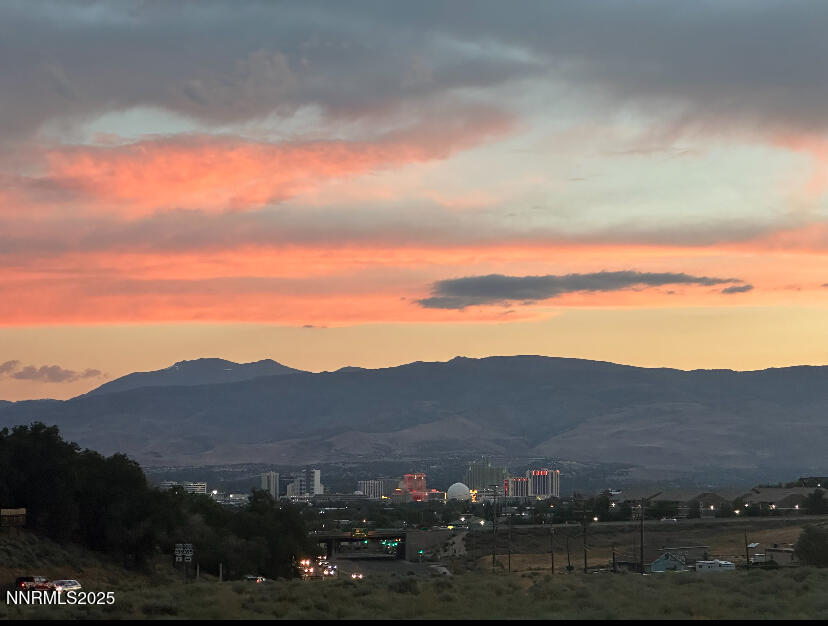 3865 East Leonesio Drive, Unit H1 Reno, NV 89512 - Photo 2 of 12 a view of city and mountain