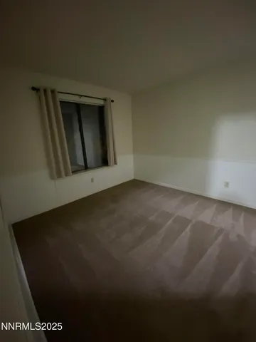 a bathroom with a bathtub and a toilet