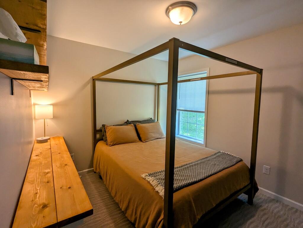 1251 Epperly Mill Road Southwest Floyd, VA 24091 - Photo 13 of 20 a bedroom with a bed and wooden floor