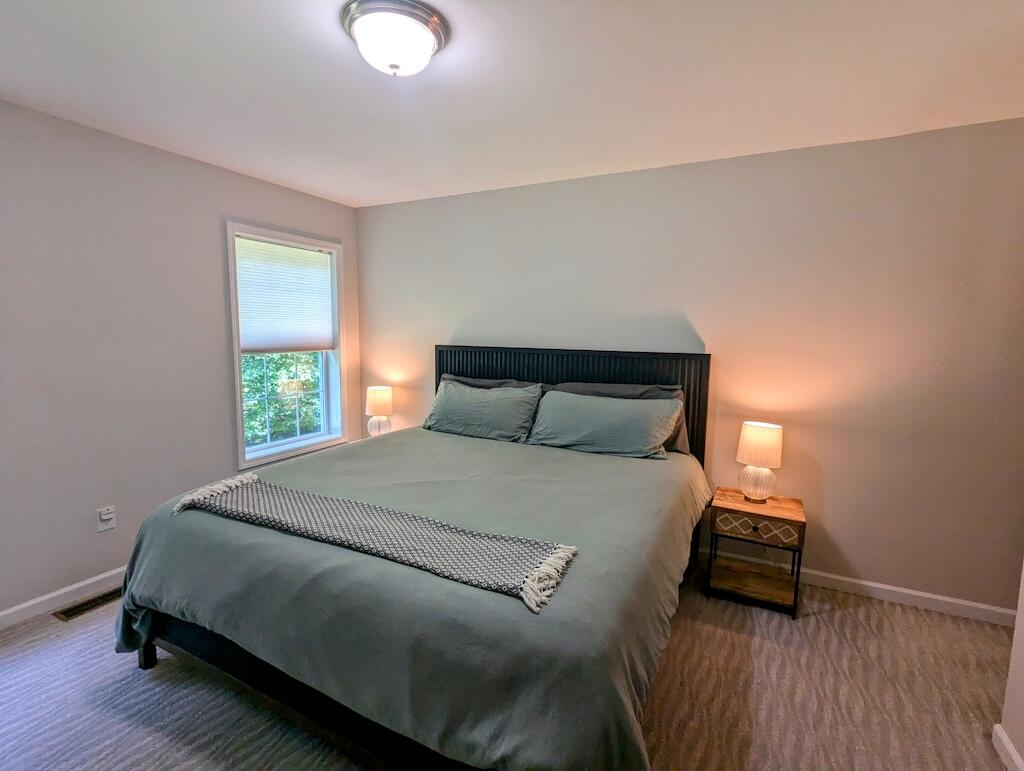 1251 Epperly Mill Road Southwest Floyd, VA 24091 - Photo 16 of 20 a bedroom with a bed and a window