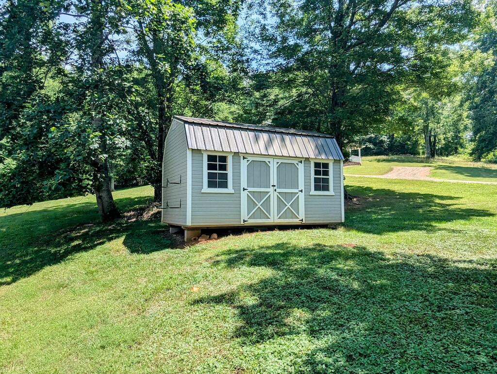 1251 Epperly Mill Road Southwest Floyd, VA 24091 - Photo 18 of 20 a view of a house with backyard and garden
