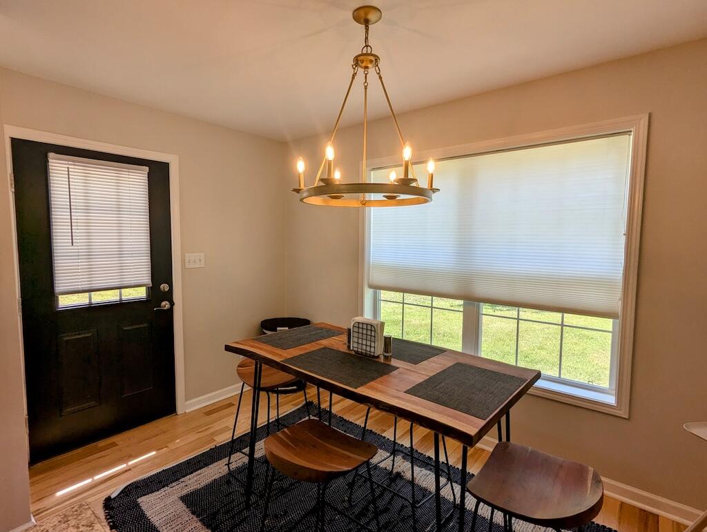 1251 Epperly Mill Road Southwest Floyd, VA 24091 - Photo 7 of 20 a view of a dining room with furniture window and wooden floor
