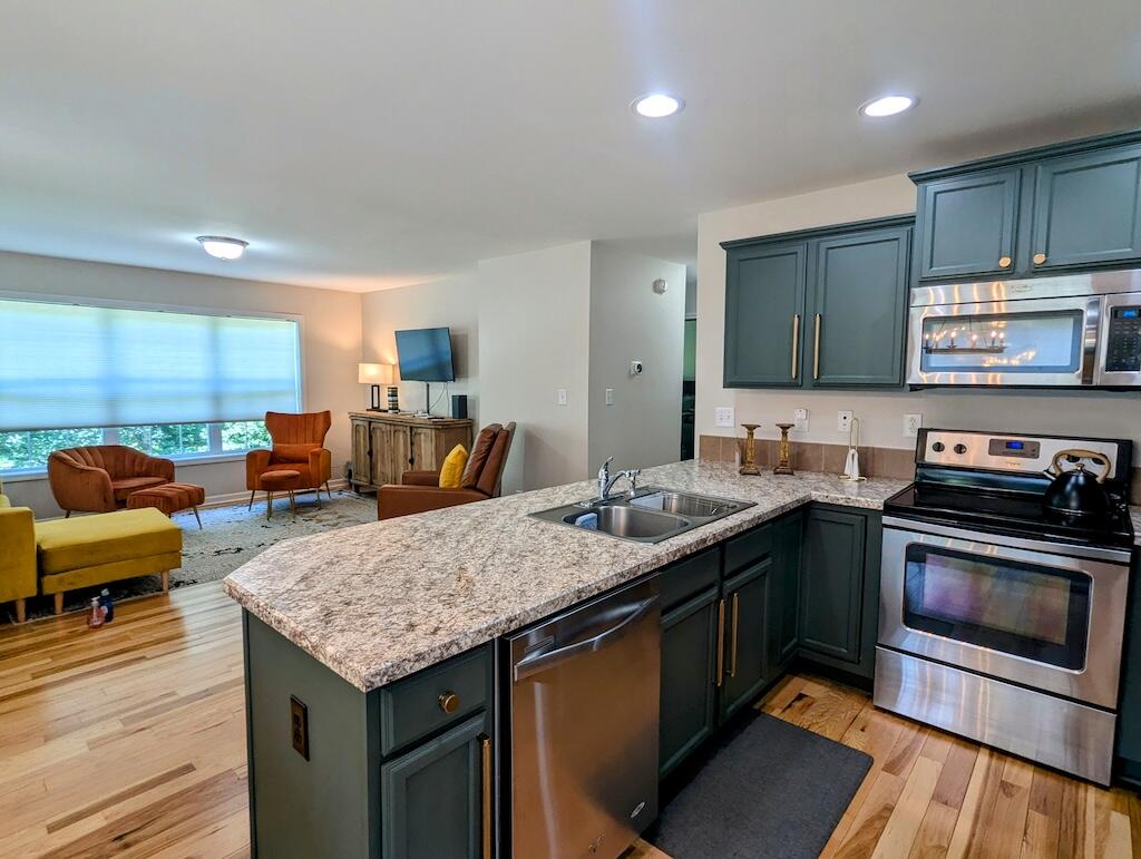 1251 Epperly Mill Road Southwest Floyd, VA 24091 - Photo 8 of 20 a kitchen with a stove and a sink