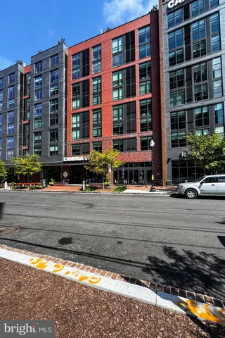 a front view of a building with a yard