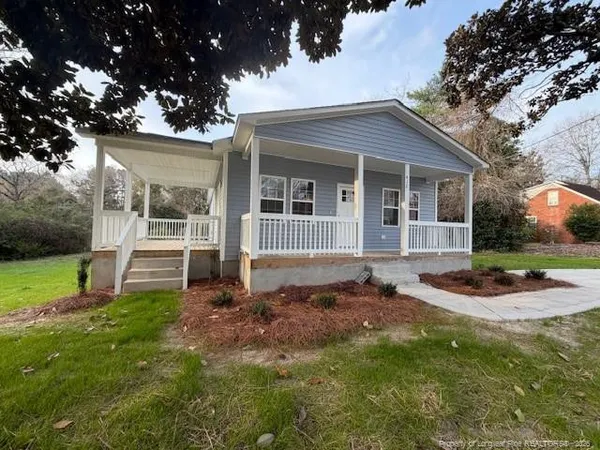 front view of a house with a yard