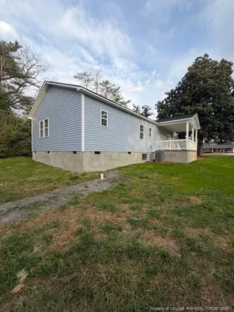 a house view with a garden space