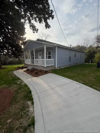 a front view of a house with yard