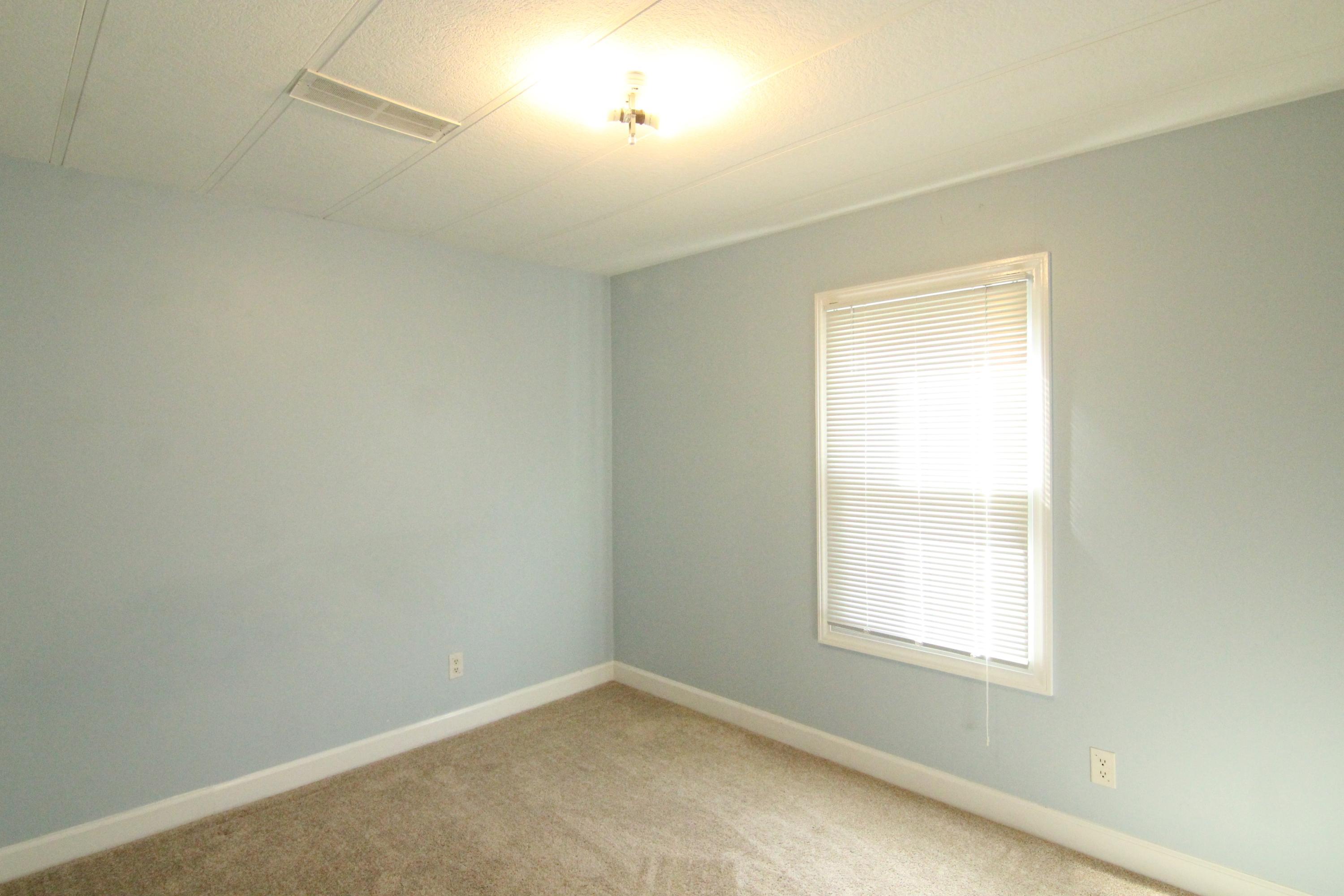 6773 Goodview Road Goodview, VA 24095 - Photo 21 of 43 an empty room with a window